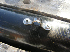 Both rivets in place.